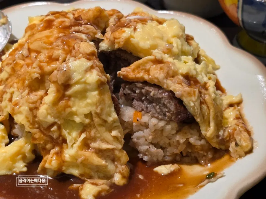 Spoonful of omurice with demi-glace sauce