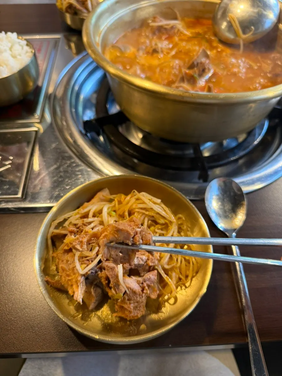 Ladle scooping up gamja jeongol broth
