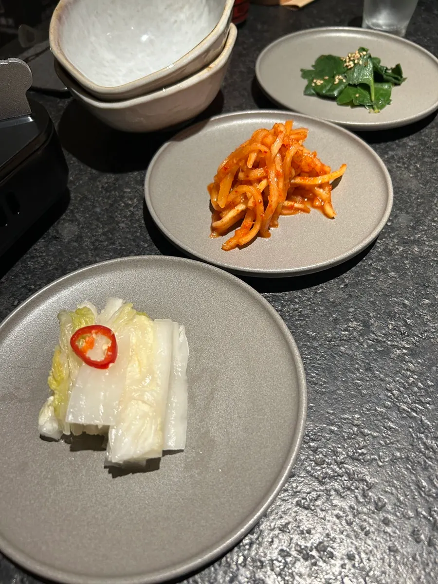 Side dishes of pickled vegetables and ginger