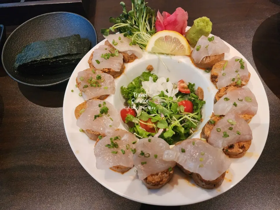 Anki liver sashimi served with seaweed