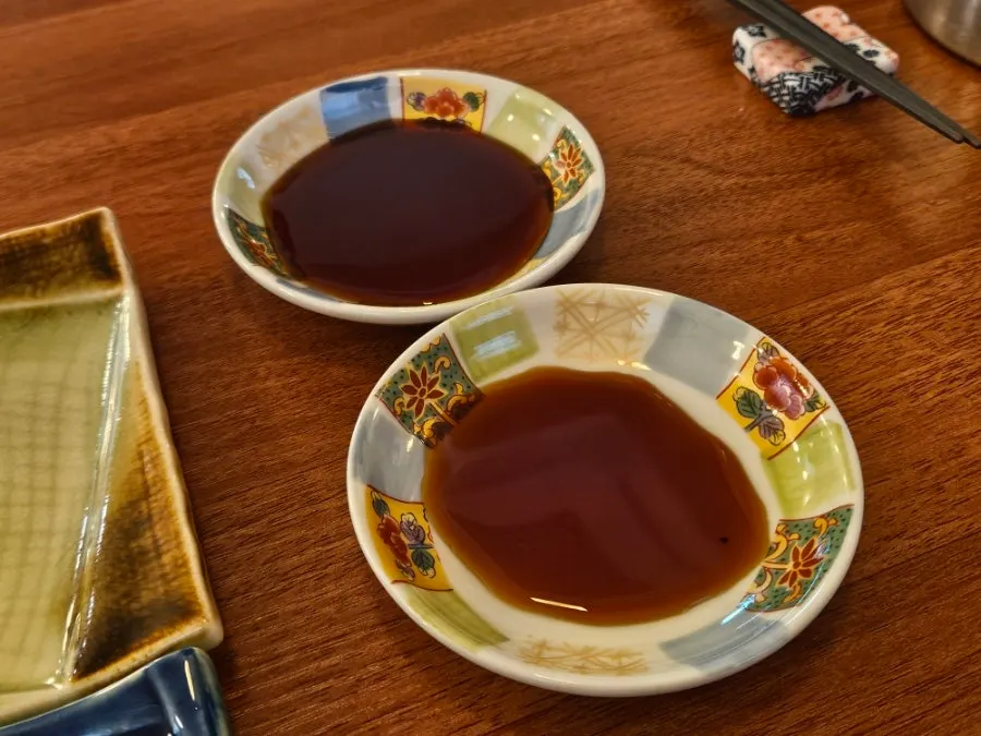 Table set with soy sauce and tableware