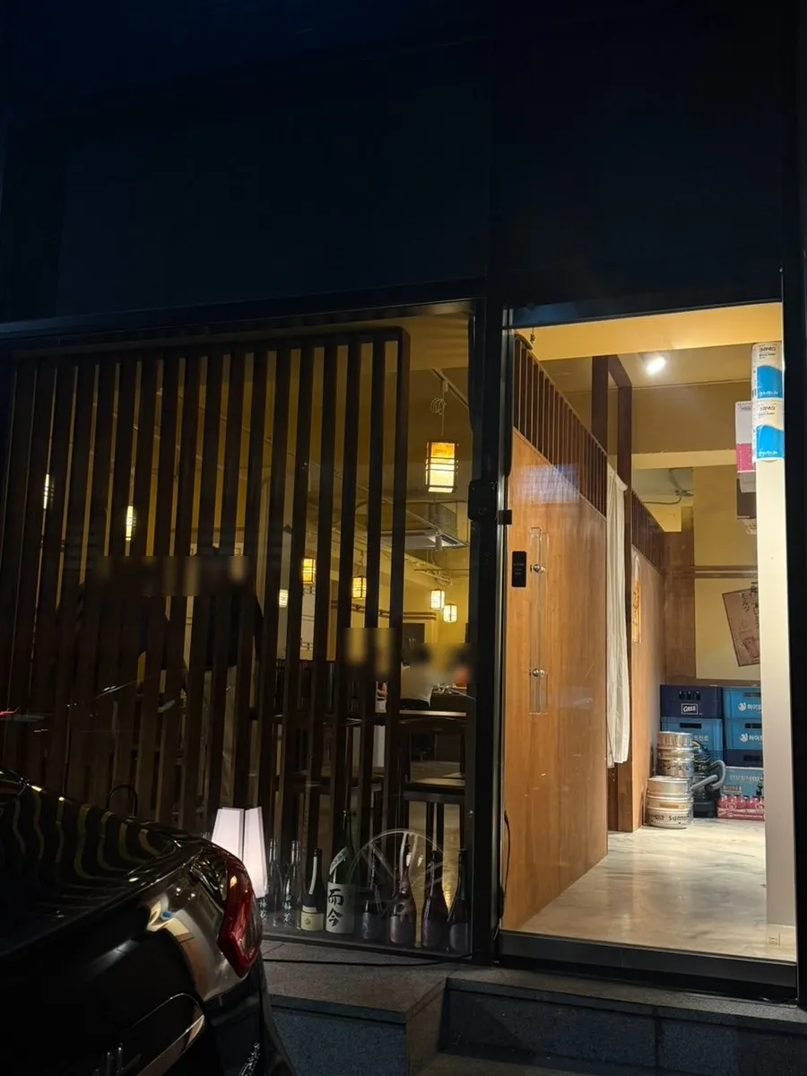 Entrance of Sakai, a Seolleung sushi sakaba, seen at night