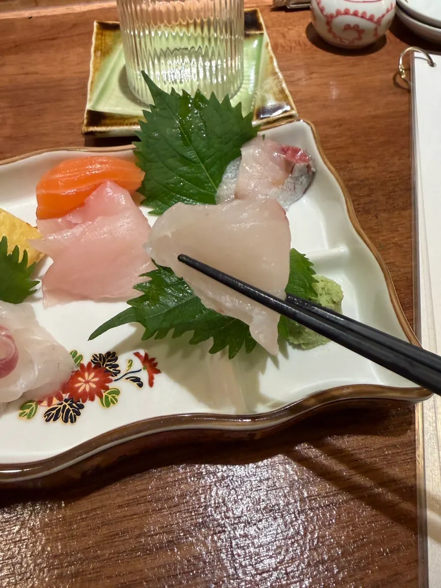 A piece of oily fish sashimi