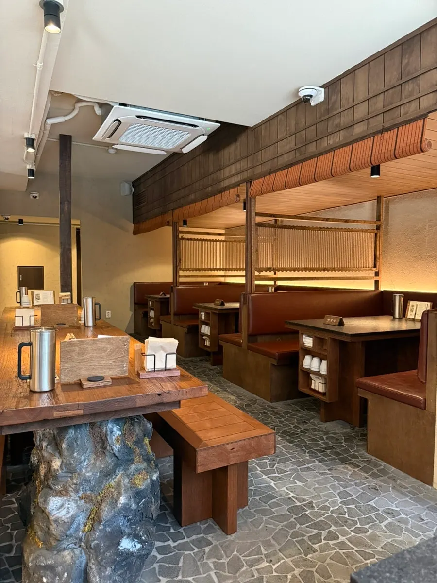 Wood-toned interior seating inside Manmok