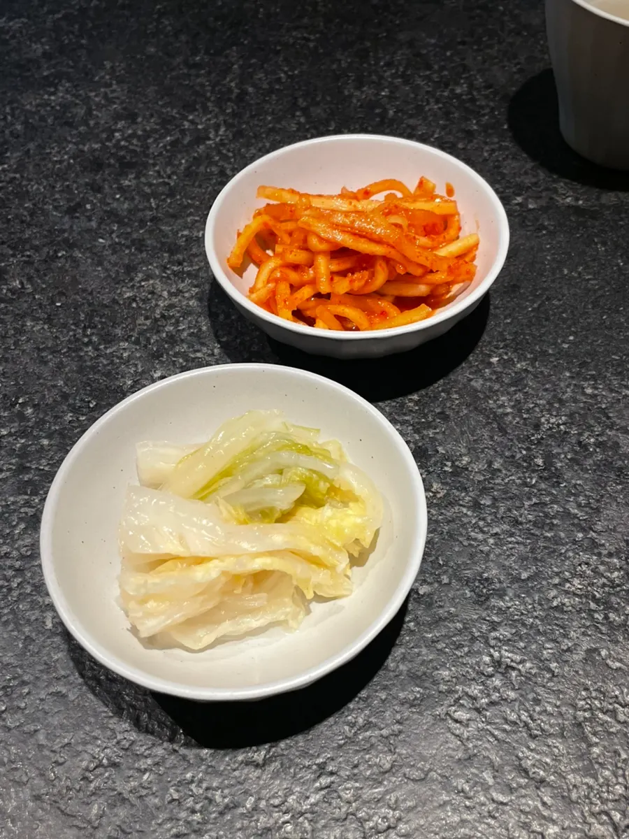 Pickled radish, pickled ginger, and fresh wasabi side dishes
