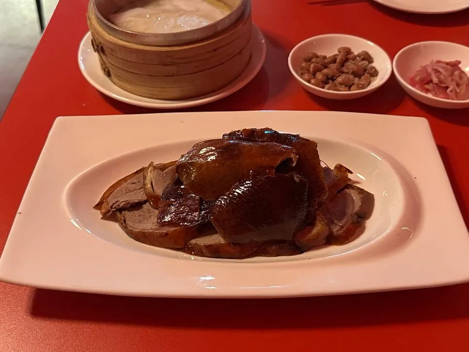 Half Peking duck arranged on a plate