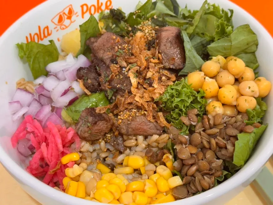 A spoonful of rice, steak, and vegetables together