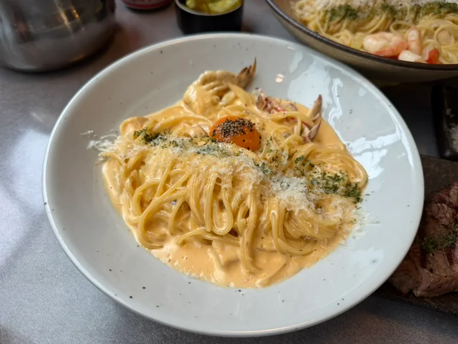 A plate of spicy crab cream pasta