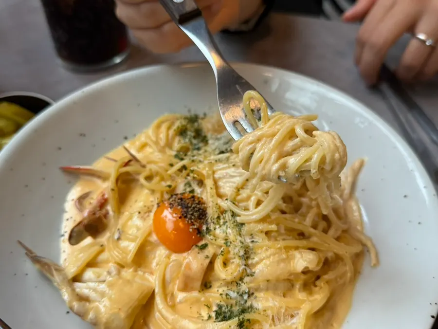 Pasta noodles coated in cream sauce