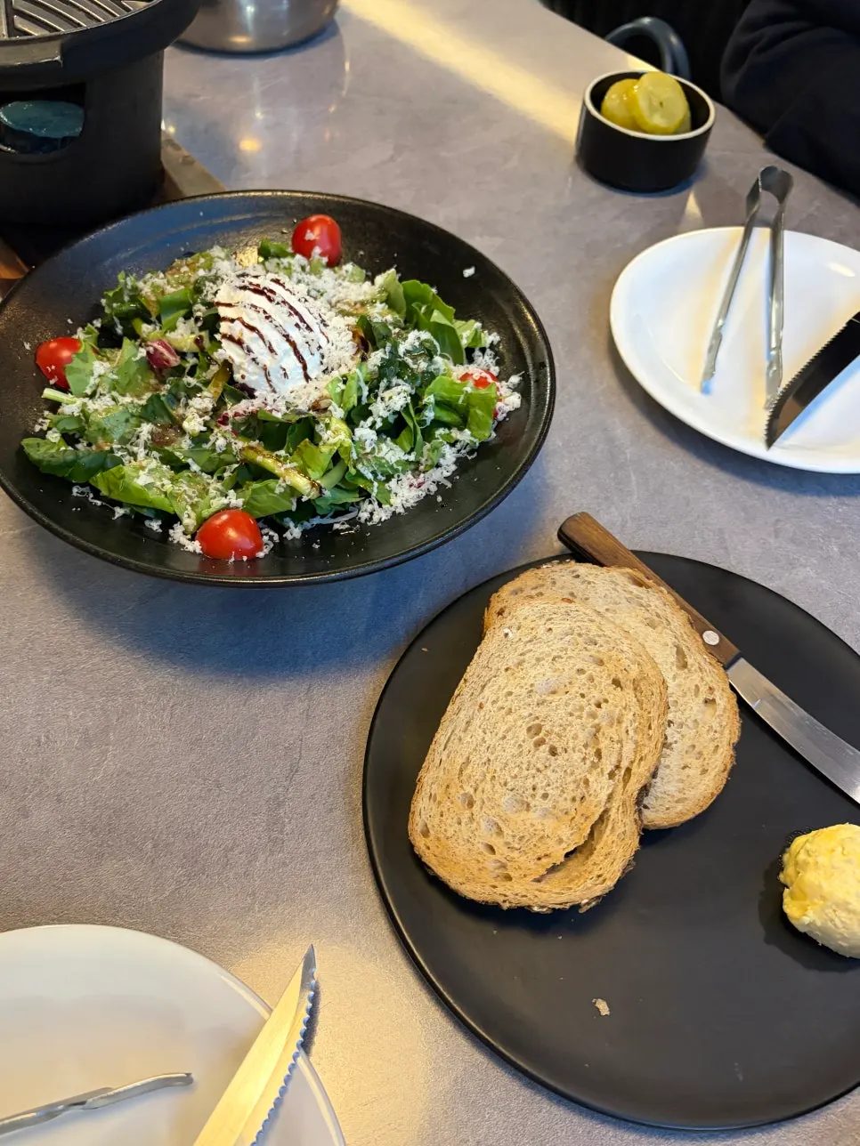 Appetizer of ricotta cheese salad and rye bread