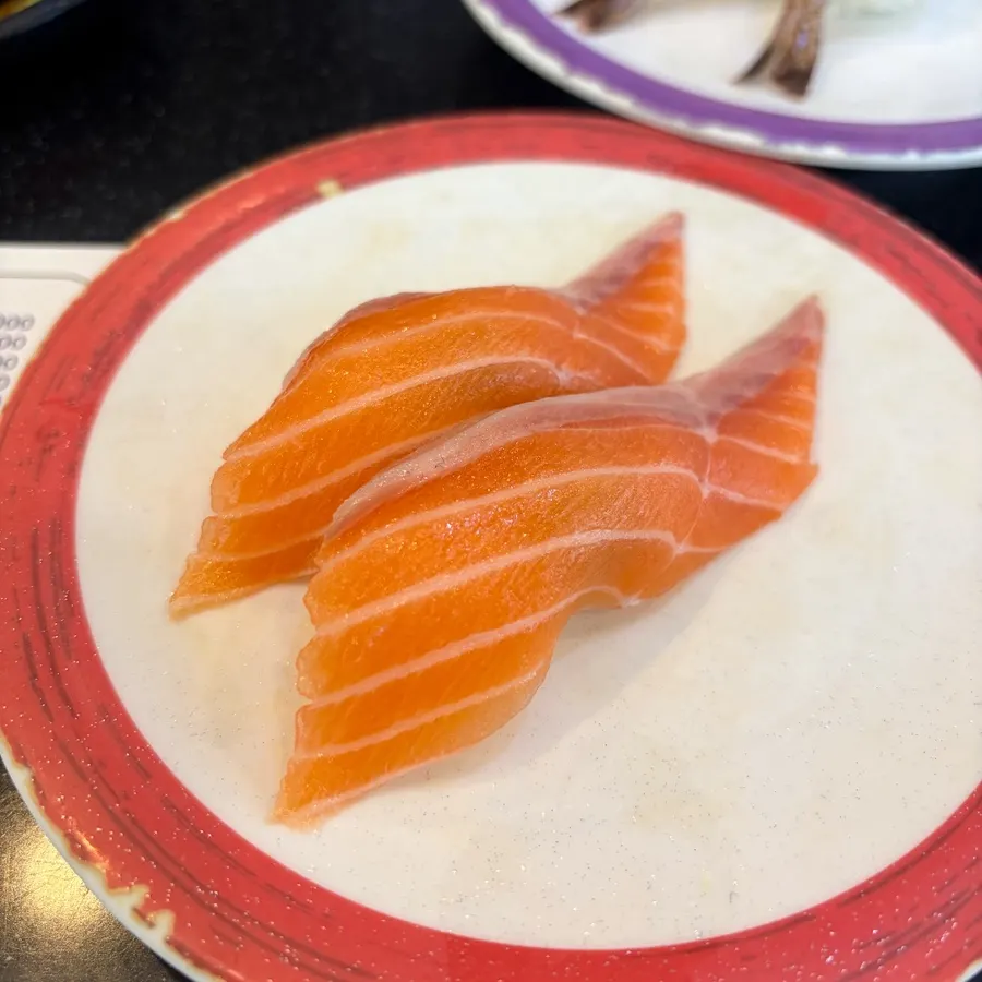 Various sushi plates going around the belt