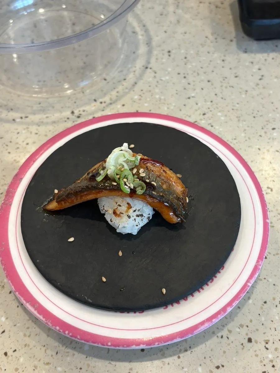 Gunkan sushi topped with sweet shrimp and sea urchin