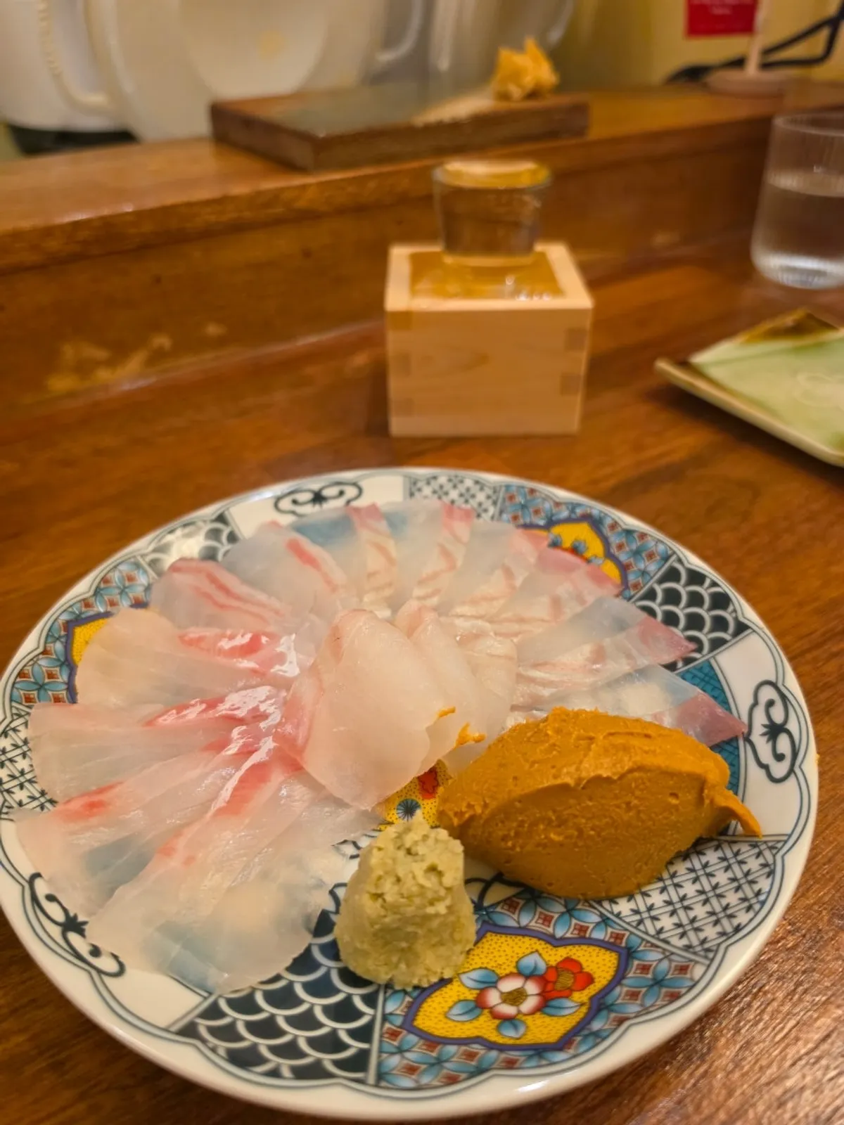 White fish sashimi arranged in a fan shape