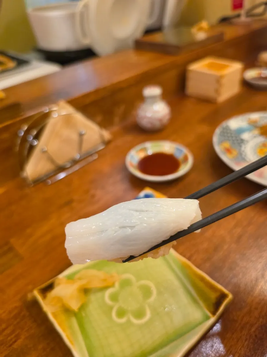 A piece of sushi shaped by the chef