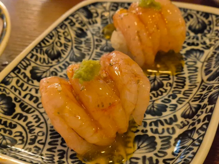 Sweet shrimp nigiri topped with egg yolk