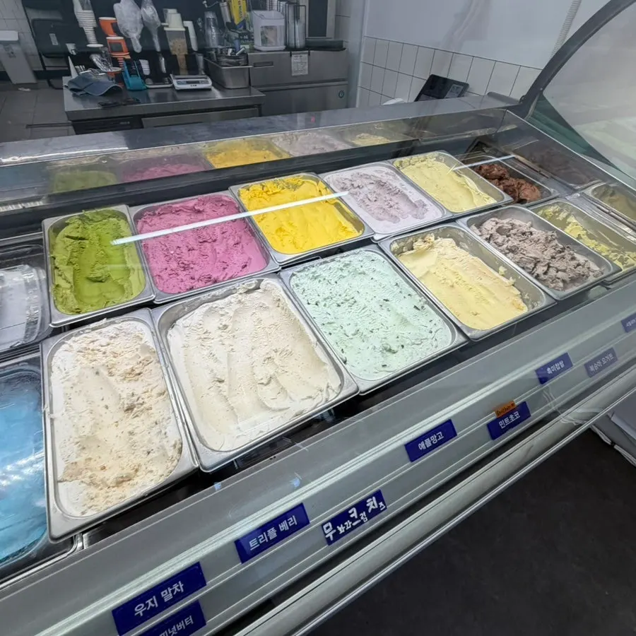 Fruit gelato flavors on display at Scoopy