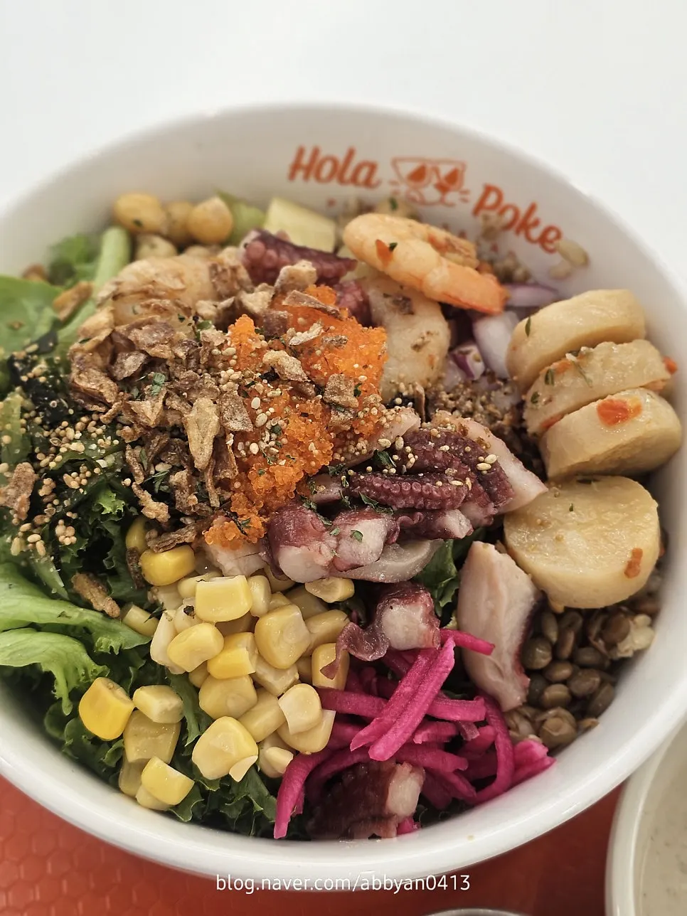 Seafood poke with evenly arranged ingredients