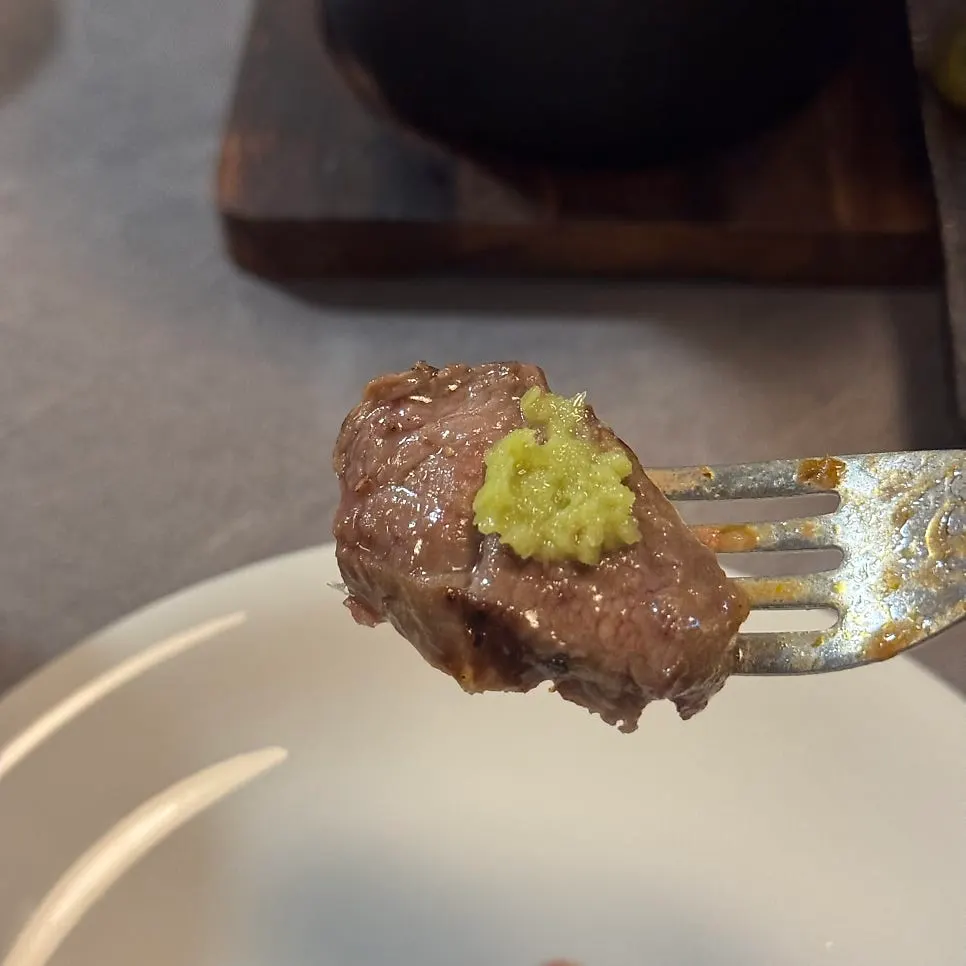 Steak grilled and eaten one piece at a time