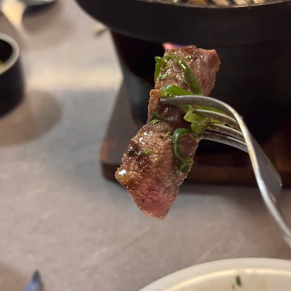 Steak cooking on the brazier