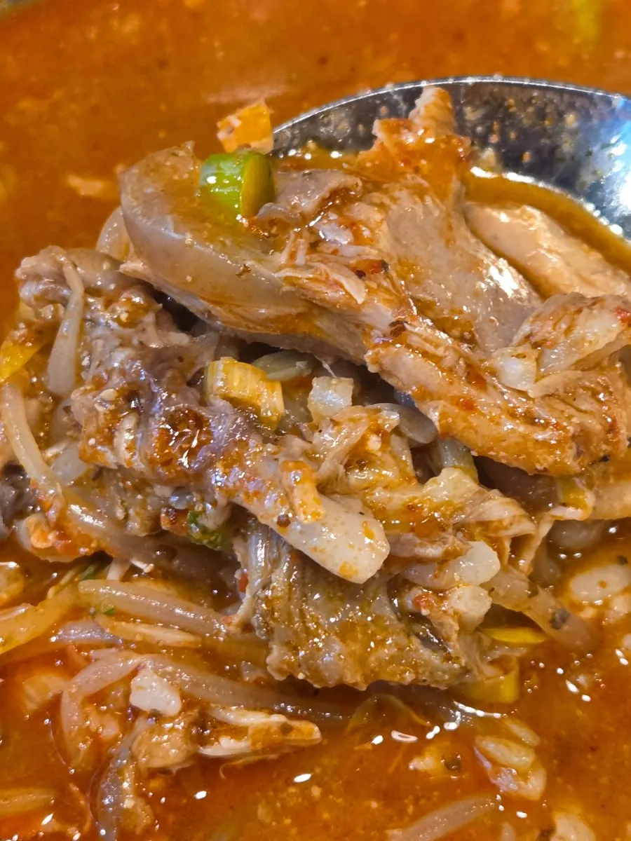 Boneless gamjatang served with a bowl of rice