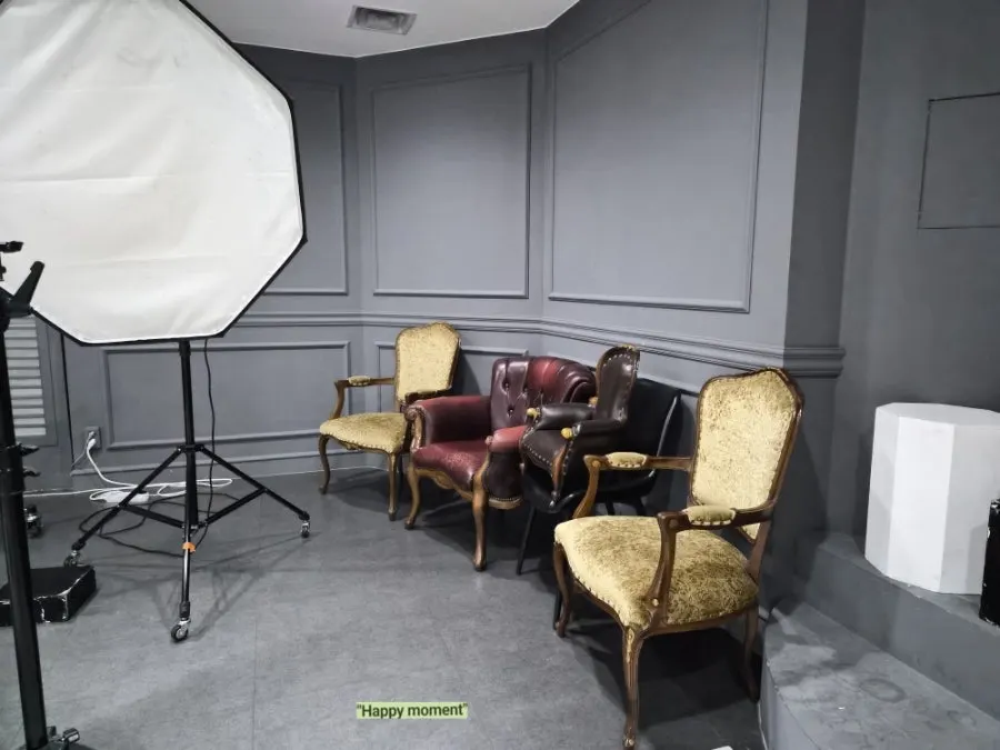 Lighting fixtures and reflectors set up in the studio