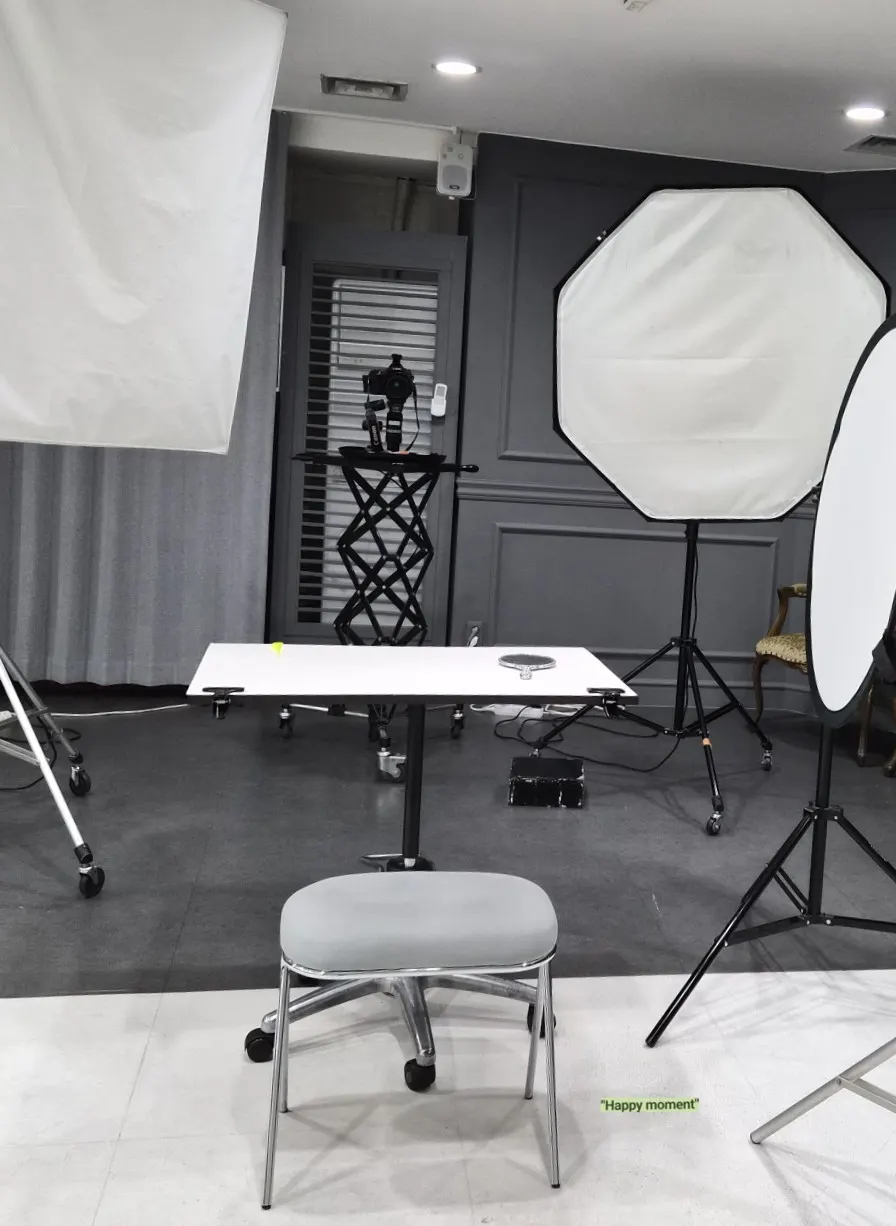 Hand mirror and white table at the shooting spot