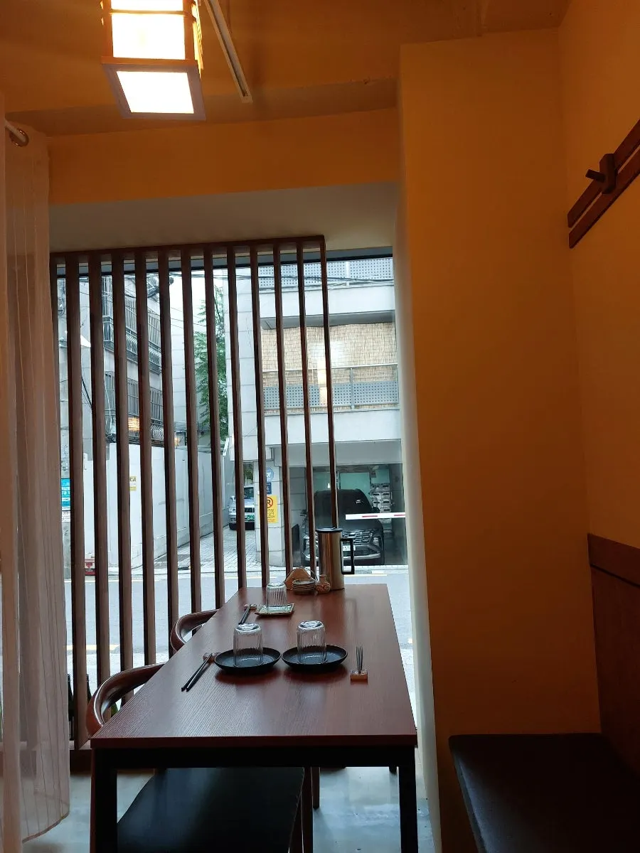 Interior of Sakai with wood-toned decor