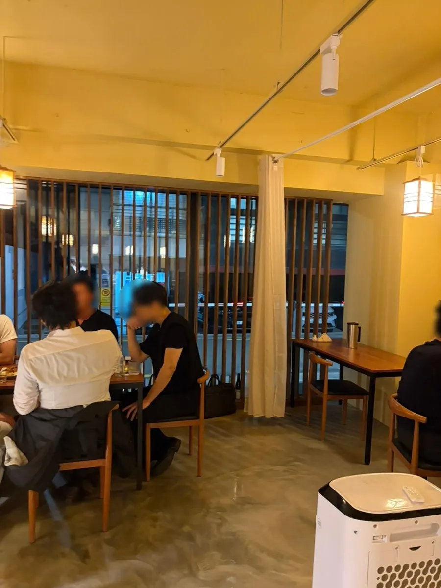 Sakai's interior lit with warm yellow lighting