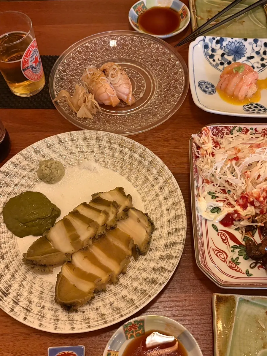Sliced abalone wine-steamed dish with geu sauce