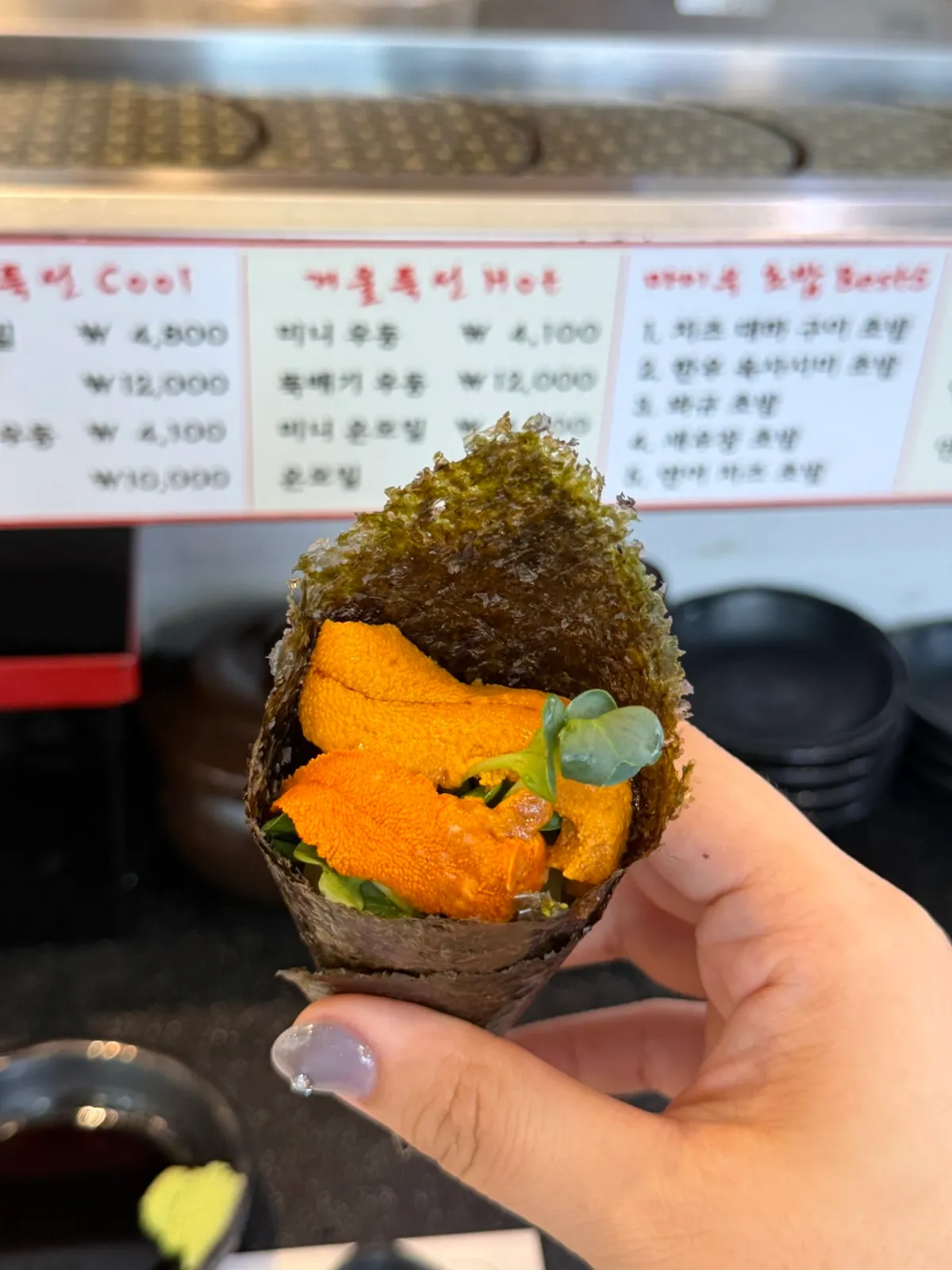 Sea urchin roe placed on top of maki