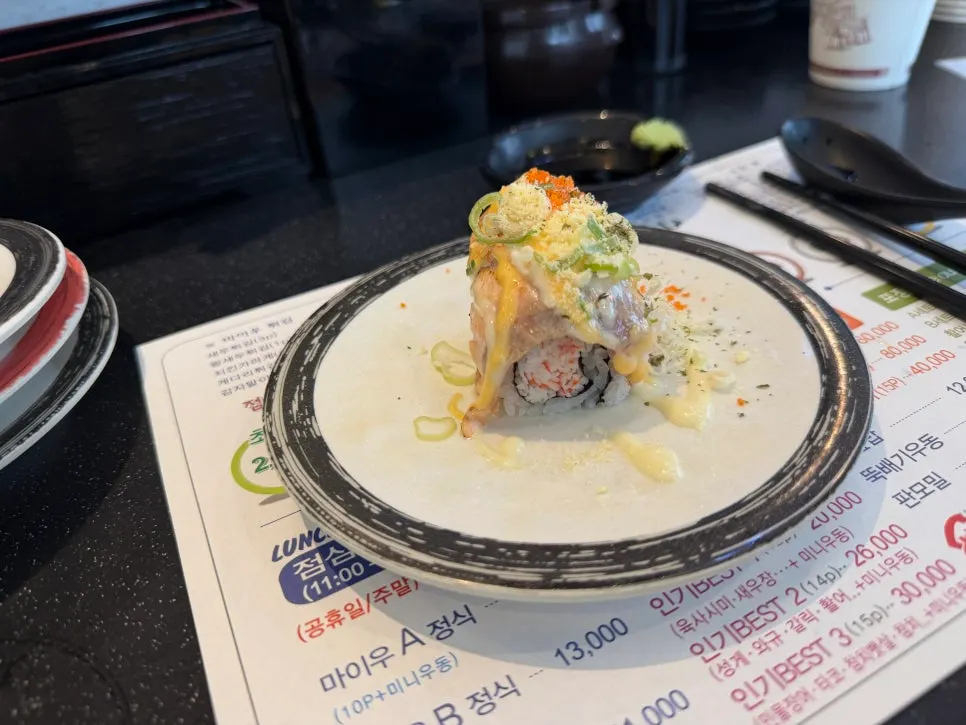 A plate of cheese grilled salmon roll