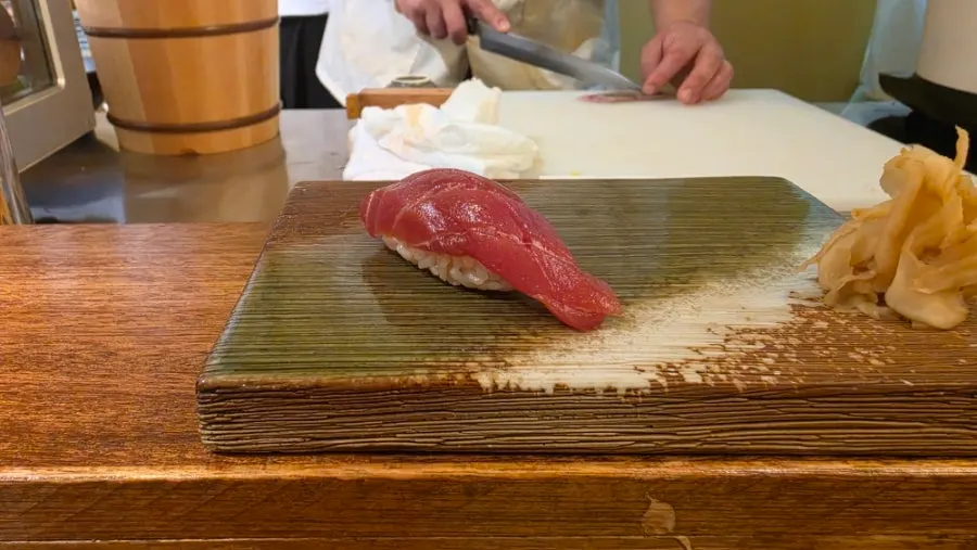 Three reordered pieces of mackerel sushi