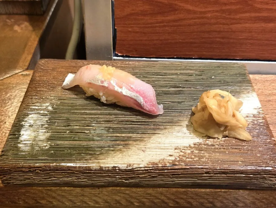 Jaetbangeo (yellowtail amberjack) nigiri topped with garlic sauce