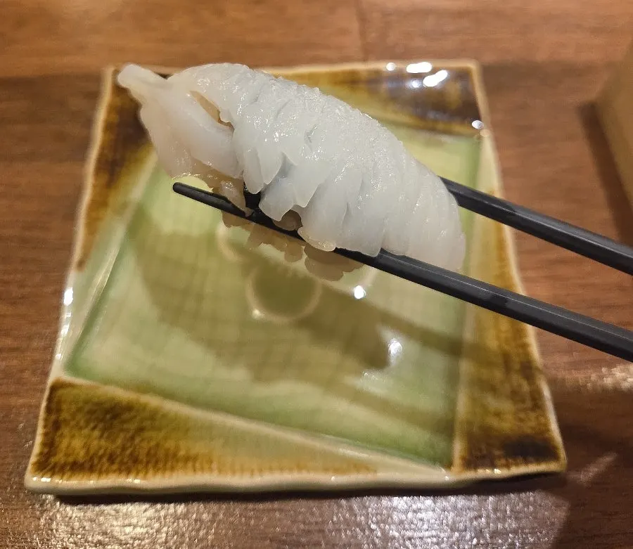 Mottled squid sushi with yuzu zest and salt