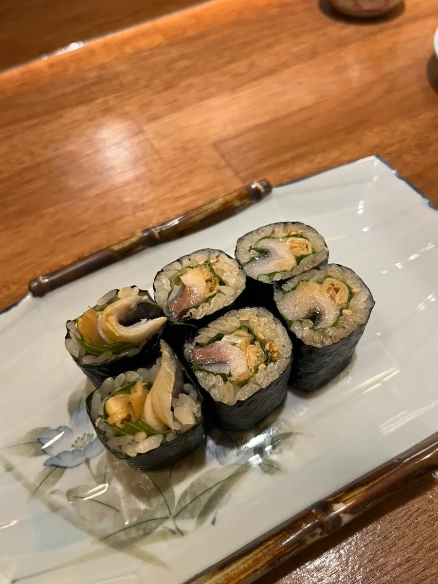Cross-section of hosomaki with mackerel and shiso