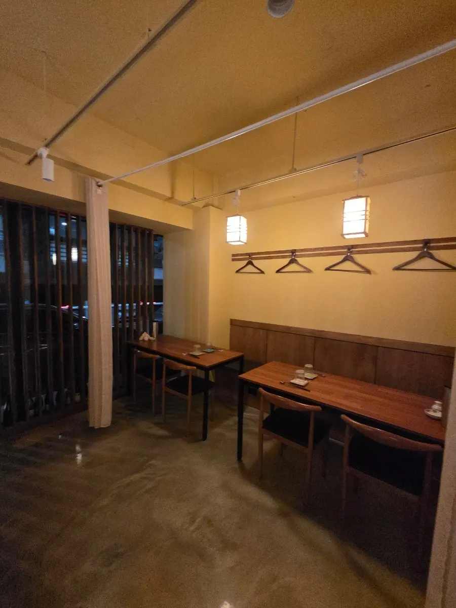 View of Sakai's counter seats and tables