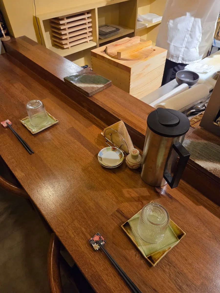 Table setting with small plate and chopsticks