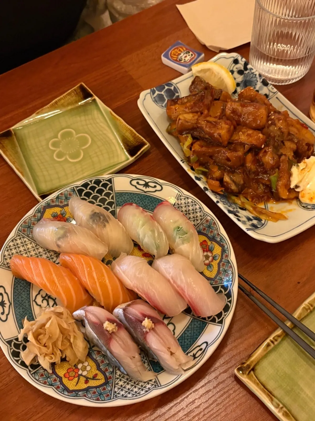 A plate of flounder, salmon, amberjack, sea bream, and mackerel nigiri