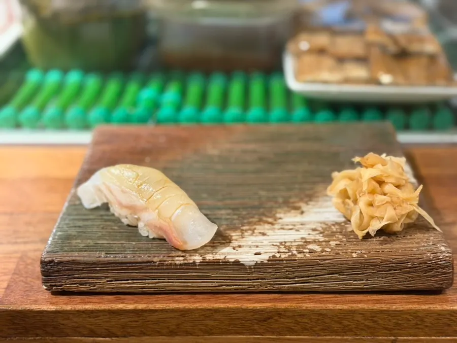 Nigiri and pickled ginger on a wooden board