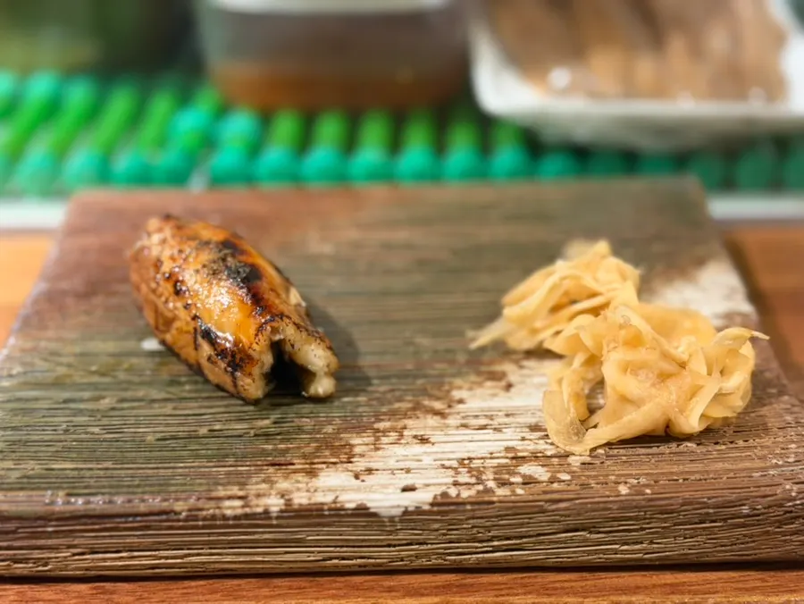 Anago nigiri being torch-seared
