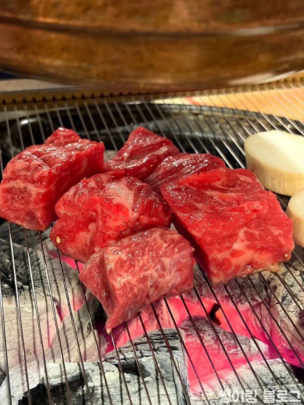 Thick diced flower cut placed on the charcoal grill