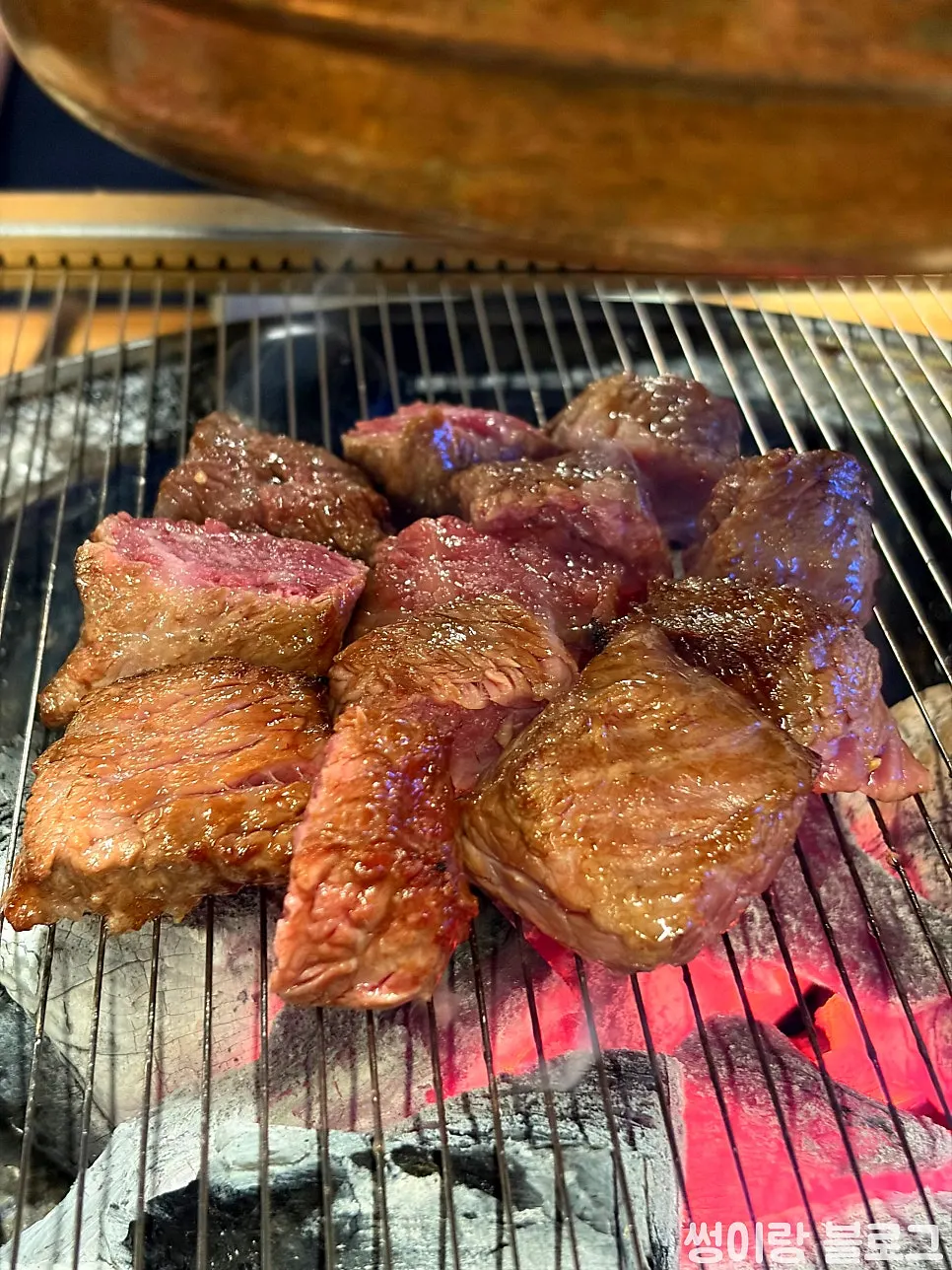 Staff grilling the diced flower cut over charcoal