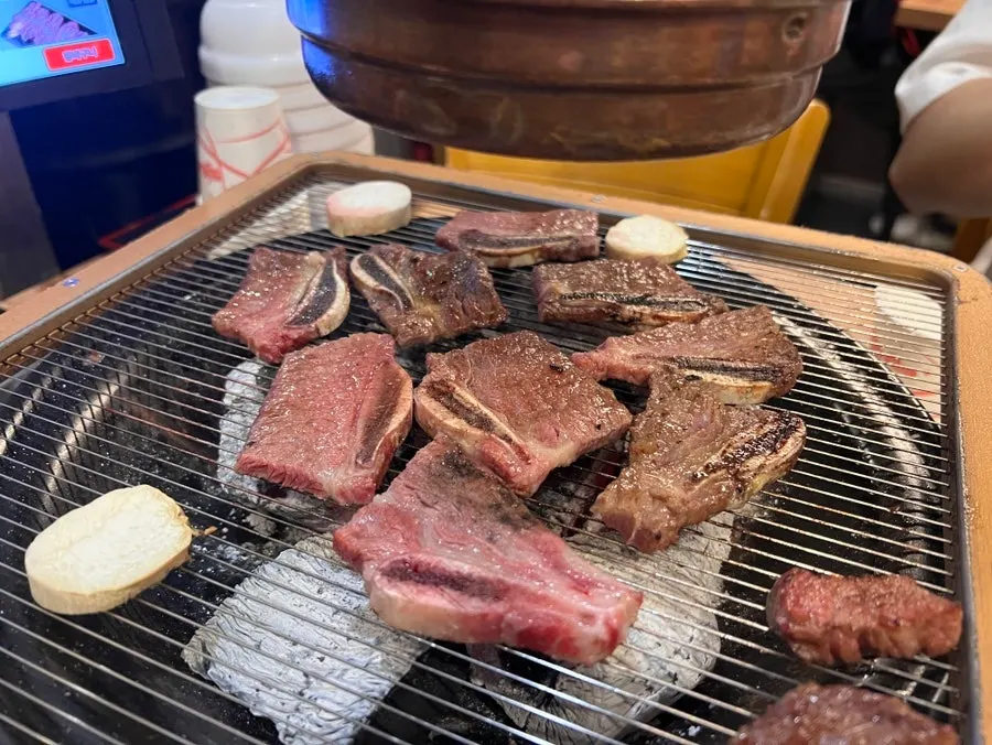 Korean beef LA galbi cooking on the grill