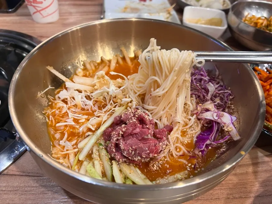 A bowl of tangy cold somyeon noodles