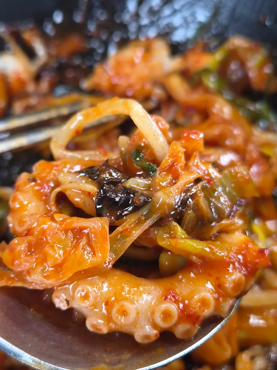 A spoonful of nakjibokkeum mixed rice