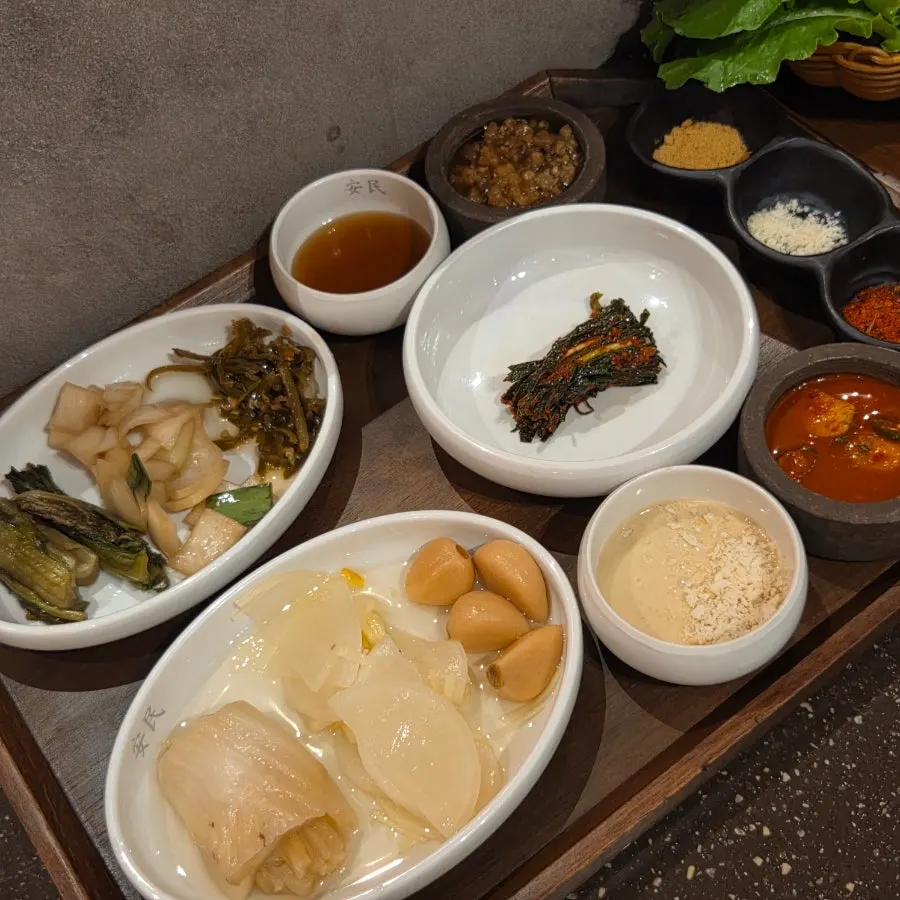 Full table with wrap vegetables and salt at Anmin Busan