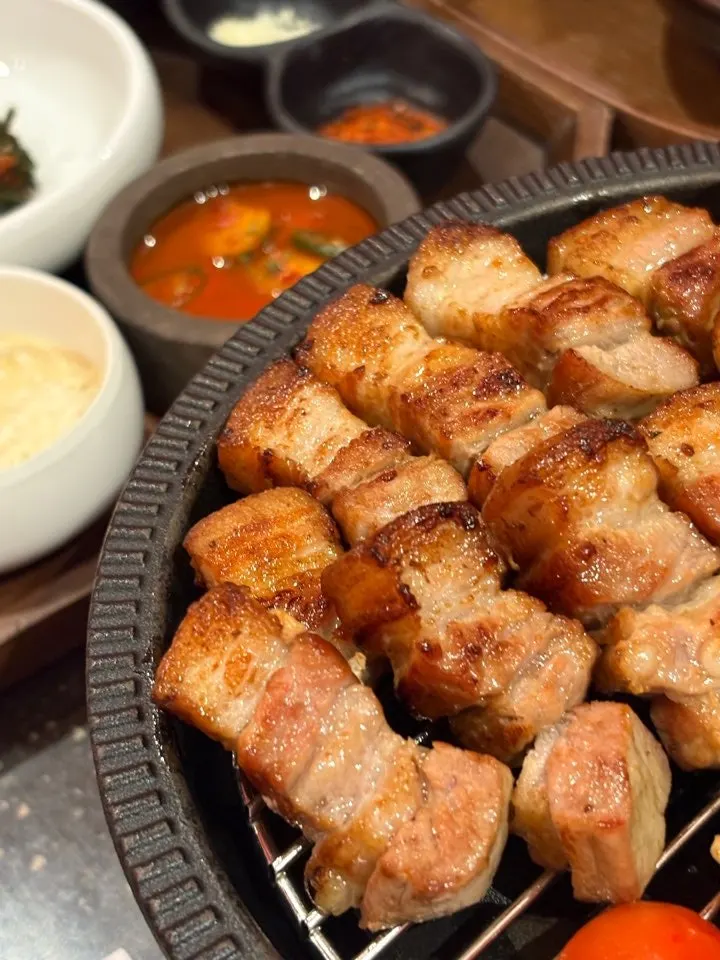 Grilled pork belly and pork neck arranged for eating