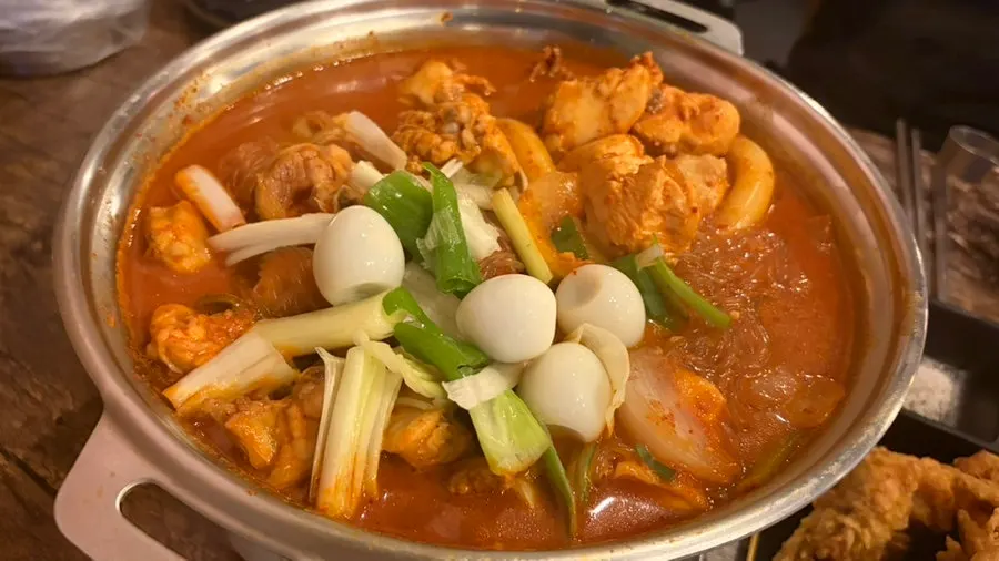 Sharing dakdoritang with a friend