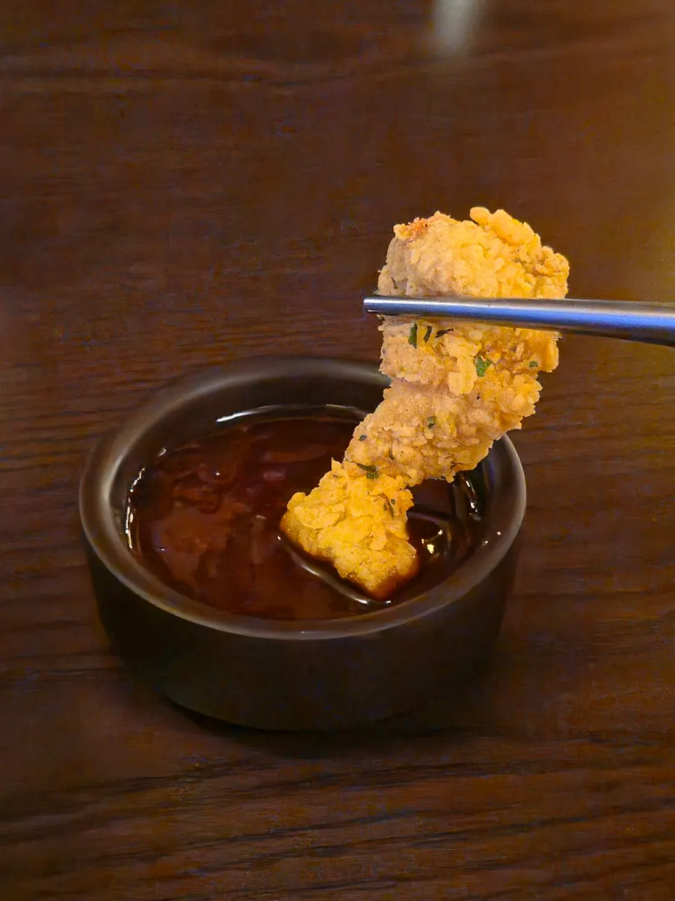 A bite-sized piece of fried boneless chicken