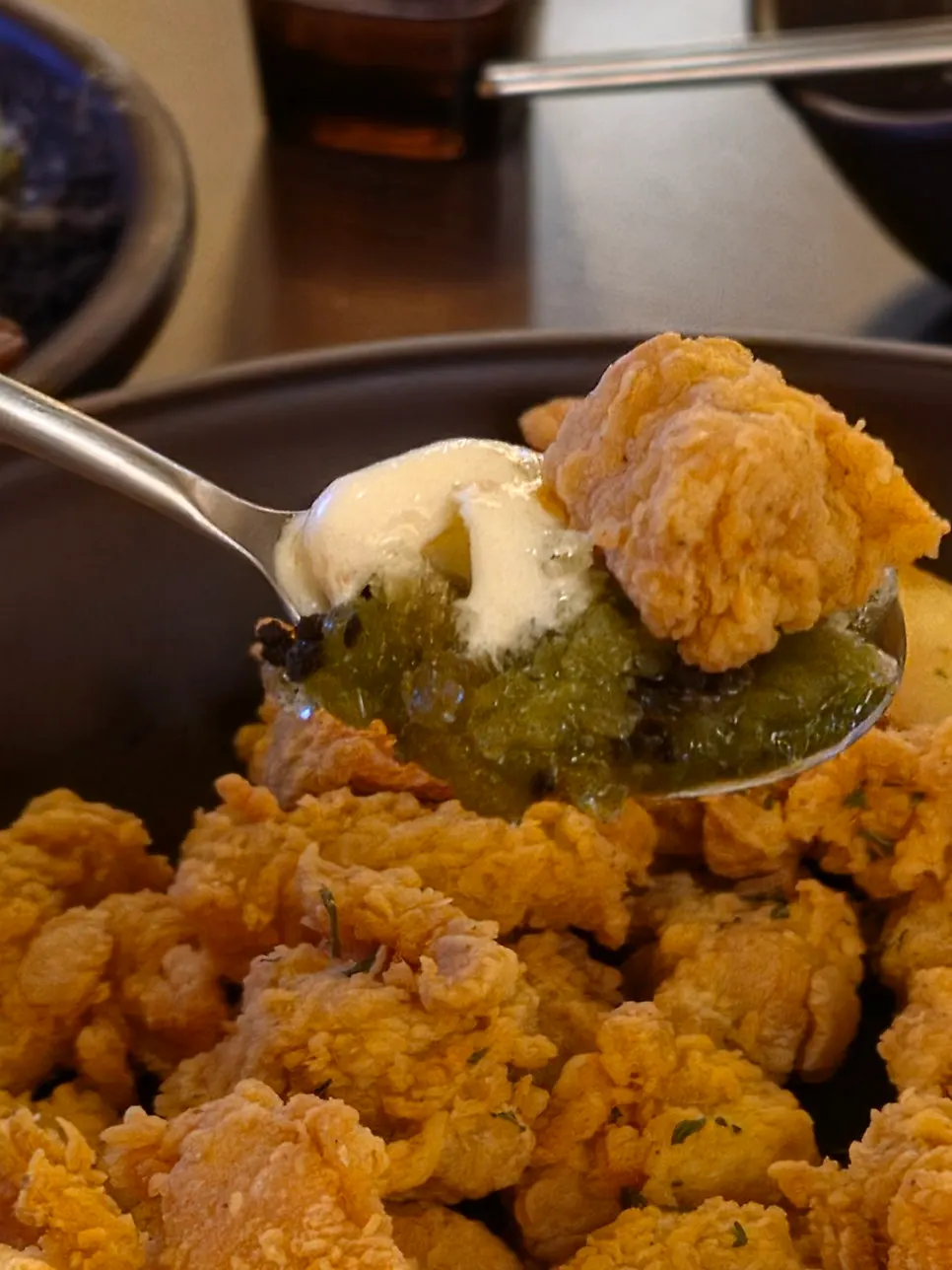 Boneless chicken dipped in the accompanying sauce